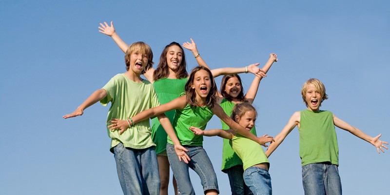 happy group of kids at summer camp singing or shouting,