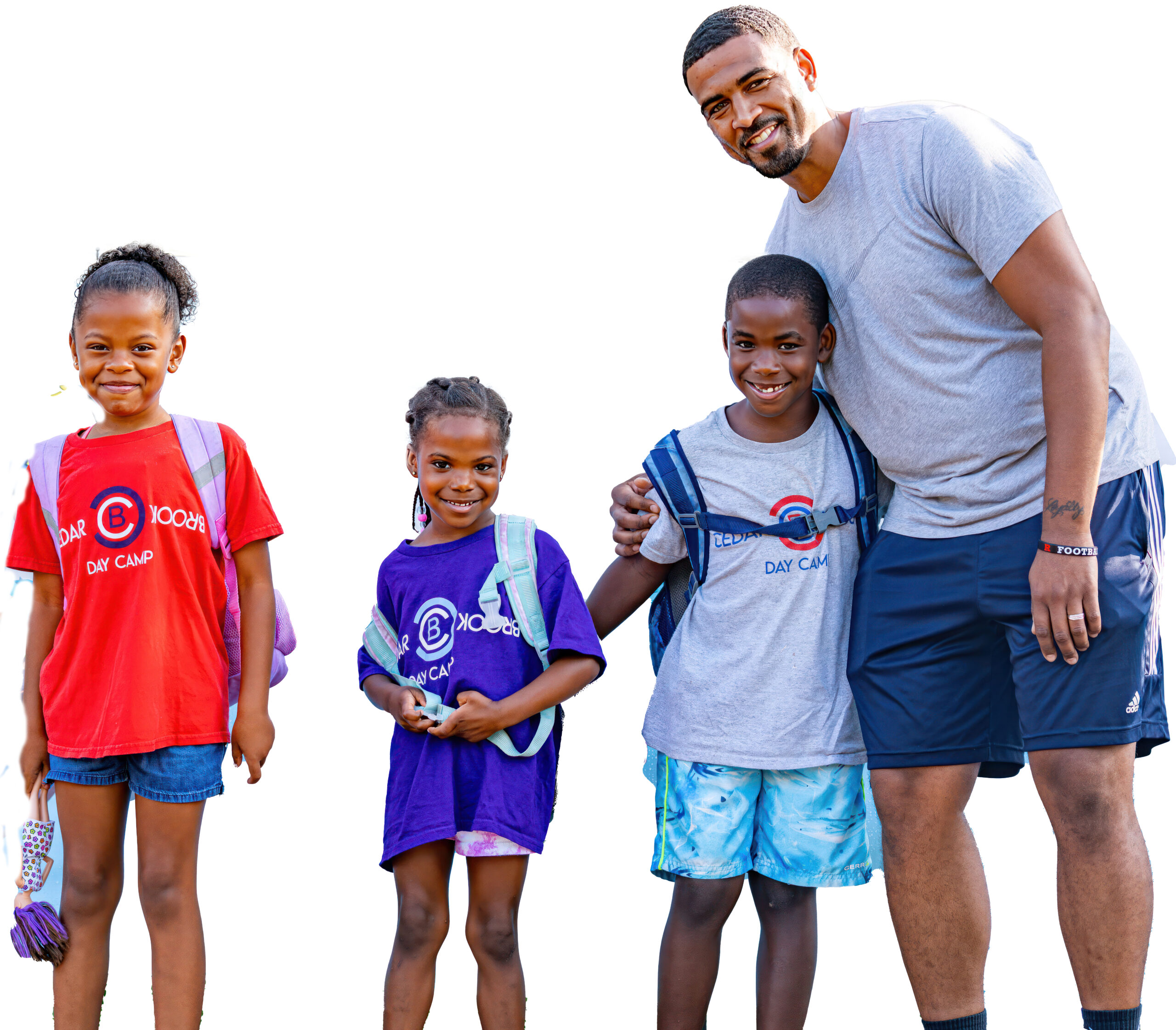 A man and two girls are standing with other people.